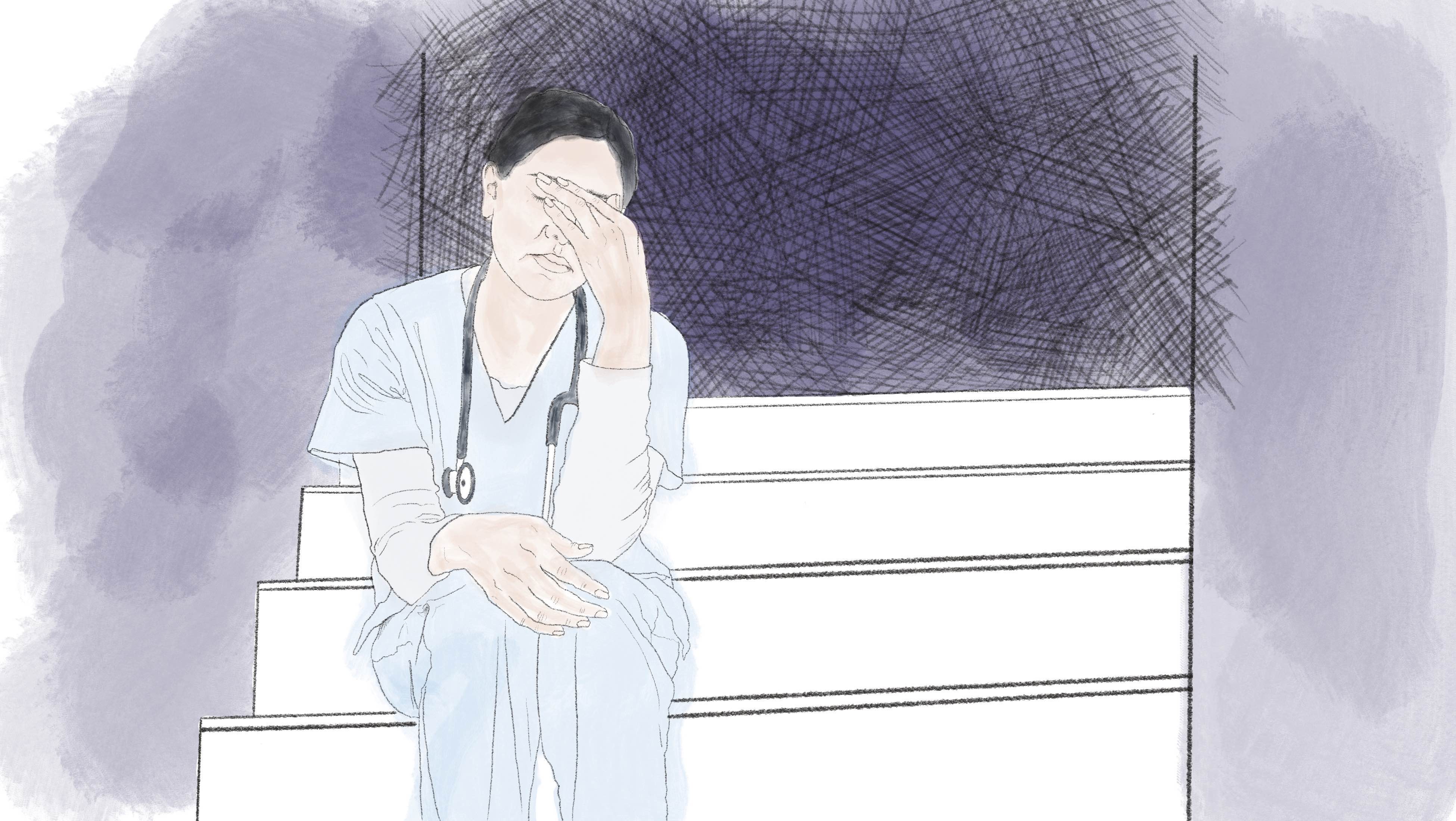 Ausgebrannt am Krankenbett: Warum viele Pflegekräfte unter Burnout leiden Eine Krankenpflegerin sitzt in der Ecke und ist einfach nur müde.